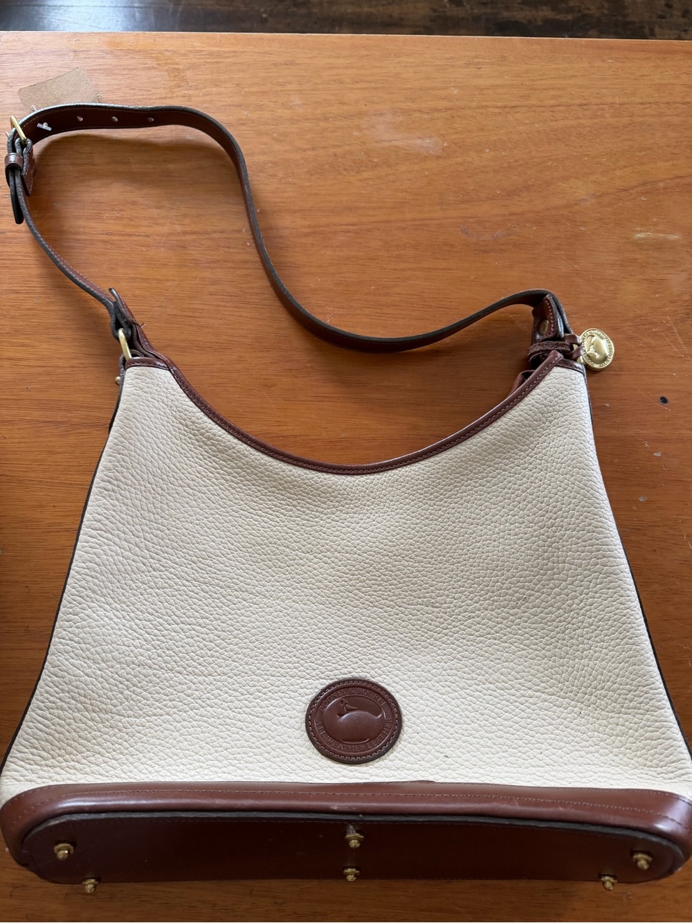 Dooney & Bourke Cream Pebbled Leather Shoulder Bag with Brown Trim
